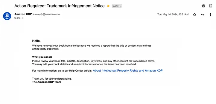 Amazon seller or KDP notification email showing a trademark infringement removal notice