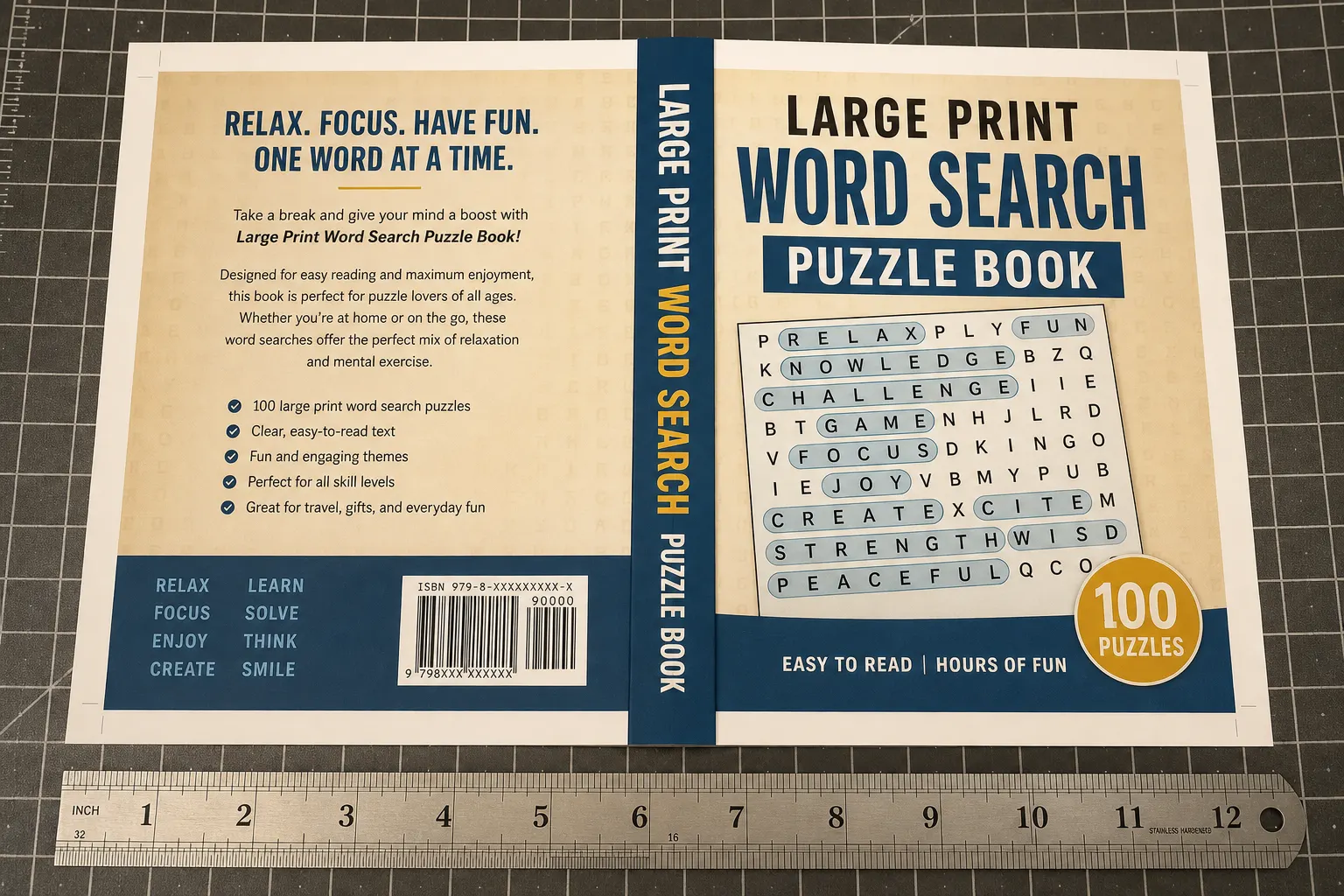 Paperback wrap layout on a cutting mat with a ruler measuring cover width for KDP print